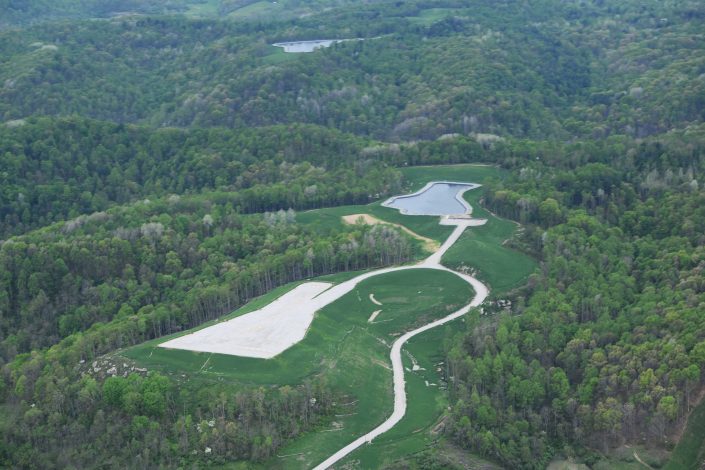 Freshwater Impoundment, hydraulically fractured well pad, and access road in Noble County, Ohio, Spring, 2016
